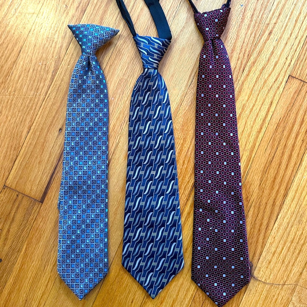 Three boys suit ties.